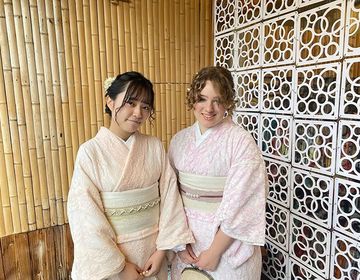 Exchange student and friend in kimonos posing together in Japan