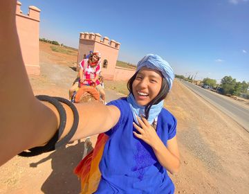 High school student in Morocco taking a self with her arm out