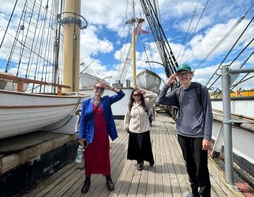 Three students on a boat