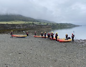 Students prepare the kayaks