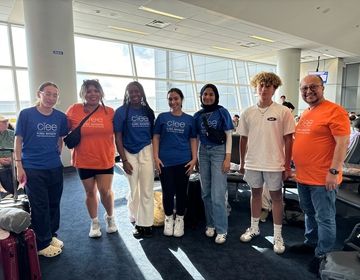 Program leaders with students at the airport