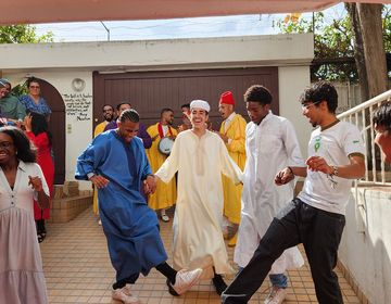 Students dancing with locals in Morocco