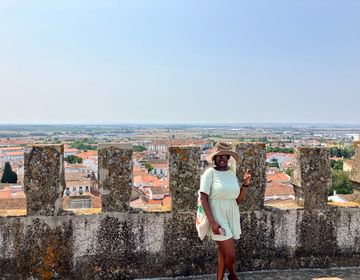 Student on a stone wall
