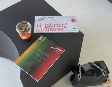 Lingering Infusion Artist cards with coffee on a bench