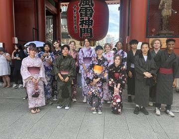 students posing in front of senso-ji temple in tokyo japan