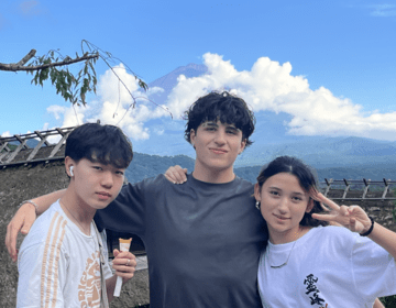 students posing in front of mt fuji