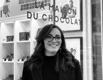 Eloise stands in front of La Maison du Chocolat, which is where she completed her CIEE BridgeUSA intern program.