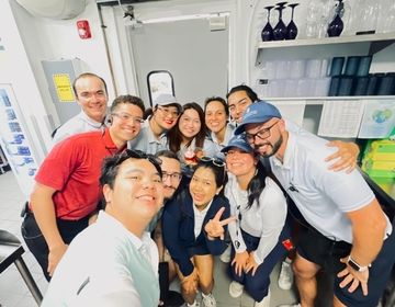Katherine poses with her Ritz-Carlton coworkers.