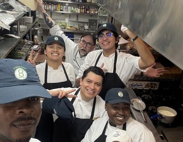 Danial poses with his internship friends for a photo.