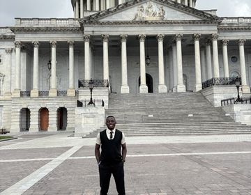 Elijah stands outside the U.S. Capitol Building.