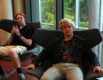 Two CBYX participants sit and ponder.