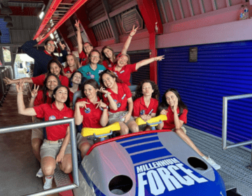 Staff from Cedar Point, A Six Flag Park in Sandusky, Ohio, pose on a ride.