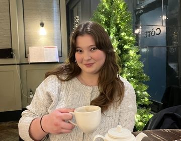 Student enjoying coffee at a nearby cafe in Berlin.