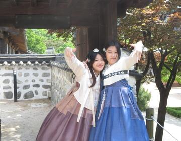 Two friends dressed in Korean hanbok (traditional dress)
