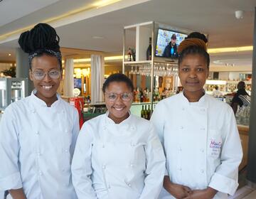 Culinary interns from South Africa pose for a photo.