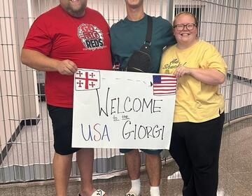 Jarred and Shannon Johnston welcome their exchange student Giorgi (center) from the country Georgia.