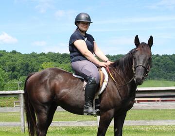 Venla S. poses on her horse