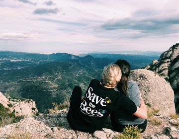 barcelona students hugging at overlook