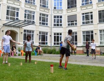 Students playing a game in a courtyard