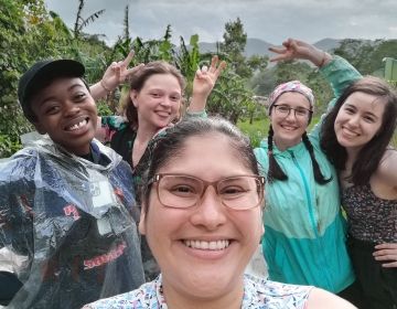 Students taking a group selfie in Monteverde forest