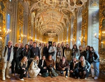 Tour group in hall of mirrors in Rome