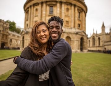 students smile together abroad london