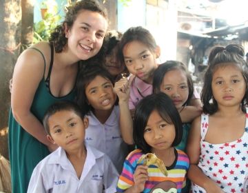 Teacher and students posing for a photo