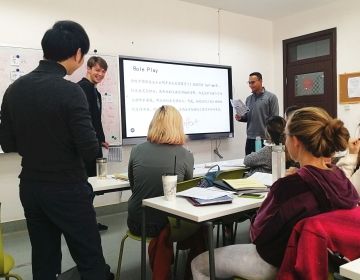 Teacher presenting to class of students in China