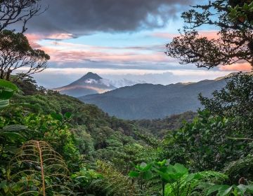 mountains in costa rica with sunset and jungle