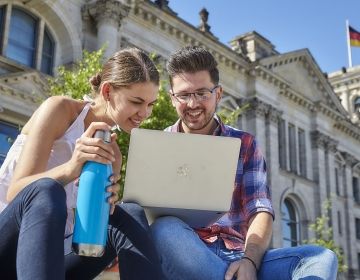 berlin study abroad students researching laptop