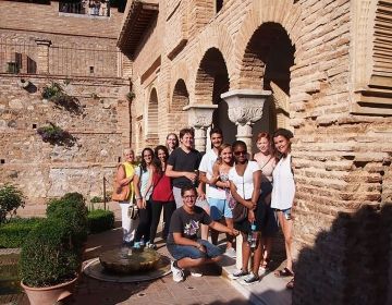 High school group posing under arch in Granada
