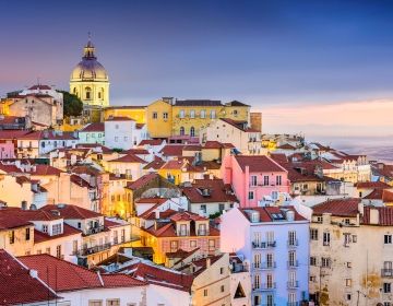 colorful houses along lisbons coast sunset