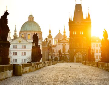 Prague Charles Bridge statues at sunrise