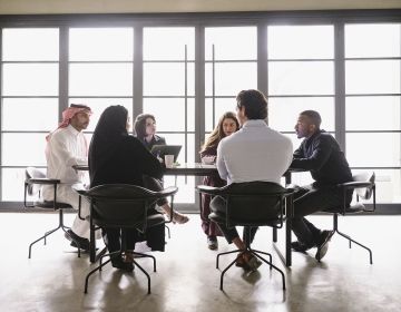 Saudi Arabian business people in meeting at work