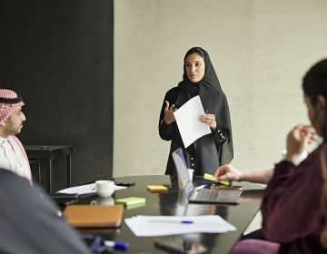 Saudi Arabian woman giving presentation at work
