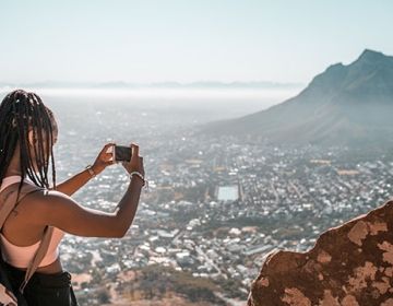 cape town girl taking photo of city skyline
