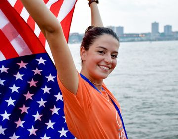 hsusa student holding american flag in NYC harbor