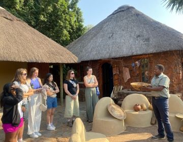 Students being taught about basket weaving in Gaborone