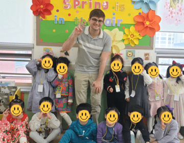 nick standing with students