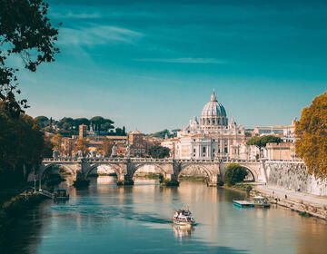 rome-river-bridge-boat-basilica
