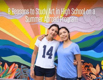 High school students standing in front of colorful mural