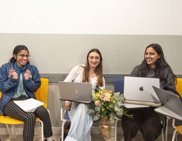 Students abroad in classroom with laptops