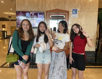 High school summer abroad students posing in front of elevator
