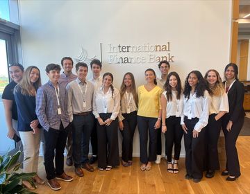 Pierre Henri poses with his coworkers at the International Finance Bank in Miami, Florida.