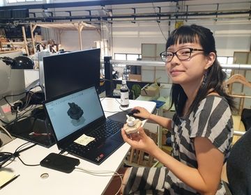 A CIEE intern works at her desk.