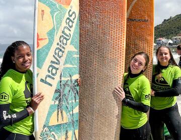 cape-town-three-female-students-posing-surf-boards