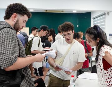 shanghai-two-male-students-speaking-instructor-orientation