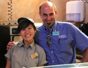 A Xanterra Travel Collection manager poses with a Summer Work Travel participant.