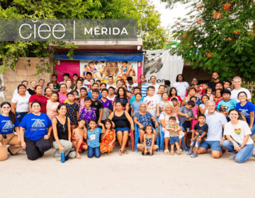 A group of students and volunteers and CIEE staff stand together and smile in Merida, Mexico