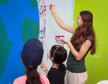 hssa-mohammedia-student-painting-with-kids.JPG